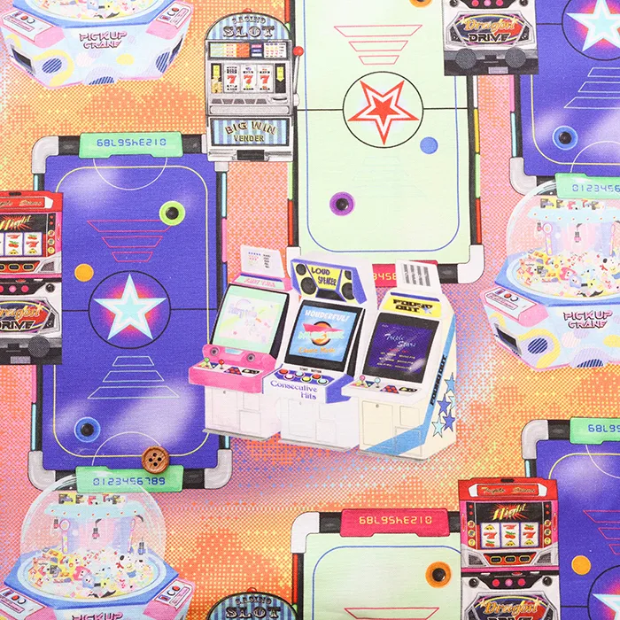 コットンシーチングプリント生地　nora.　ゲームセンター