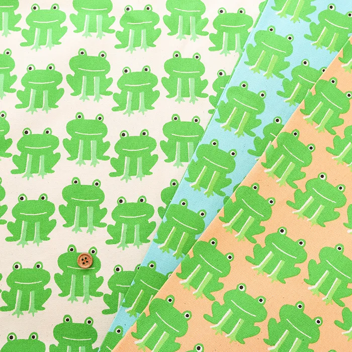 コットンオックスプリント生地　ひょこっとカエル