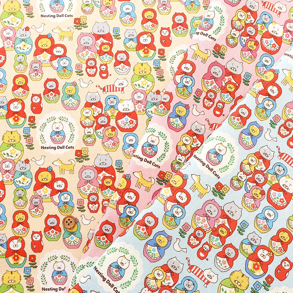 コットンキャンバスプリント生地　ネコリョーシカ