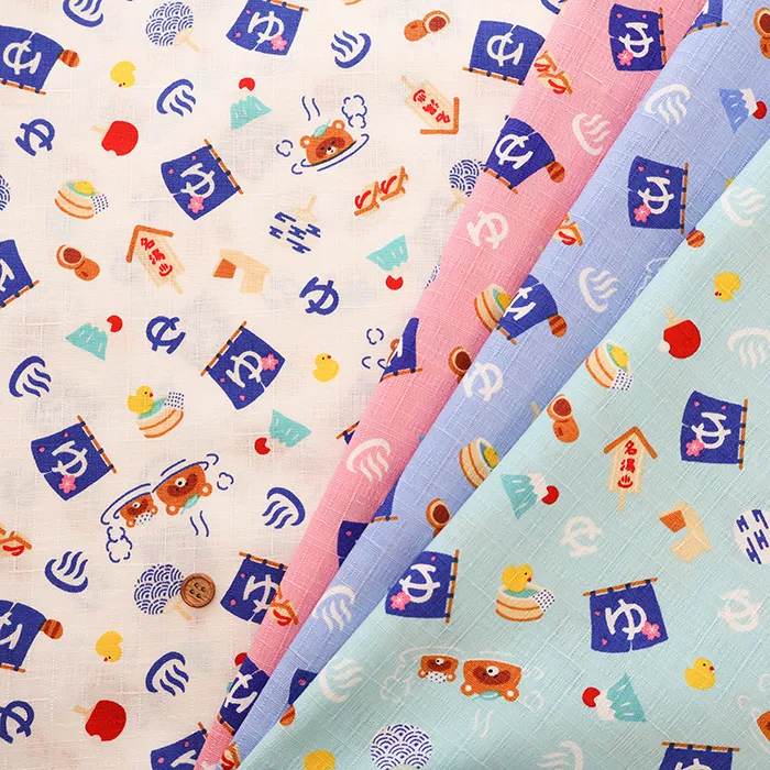 コットンドビープリント生地　温泉たぬき