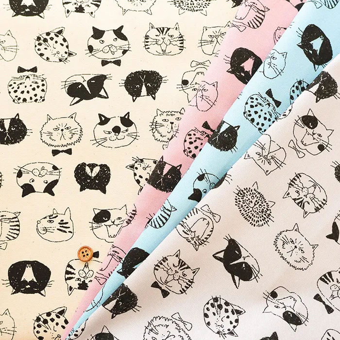 コットンオックスプリント生地　ネコの顔